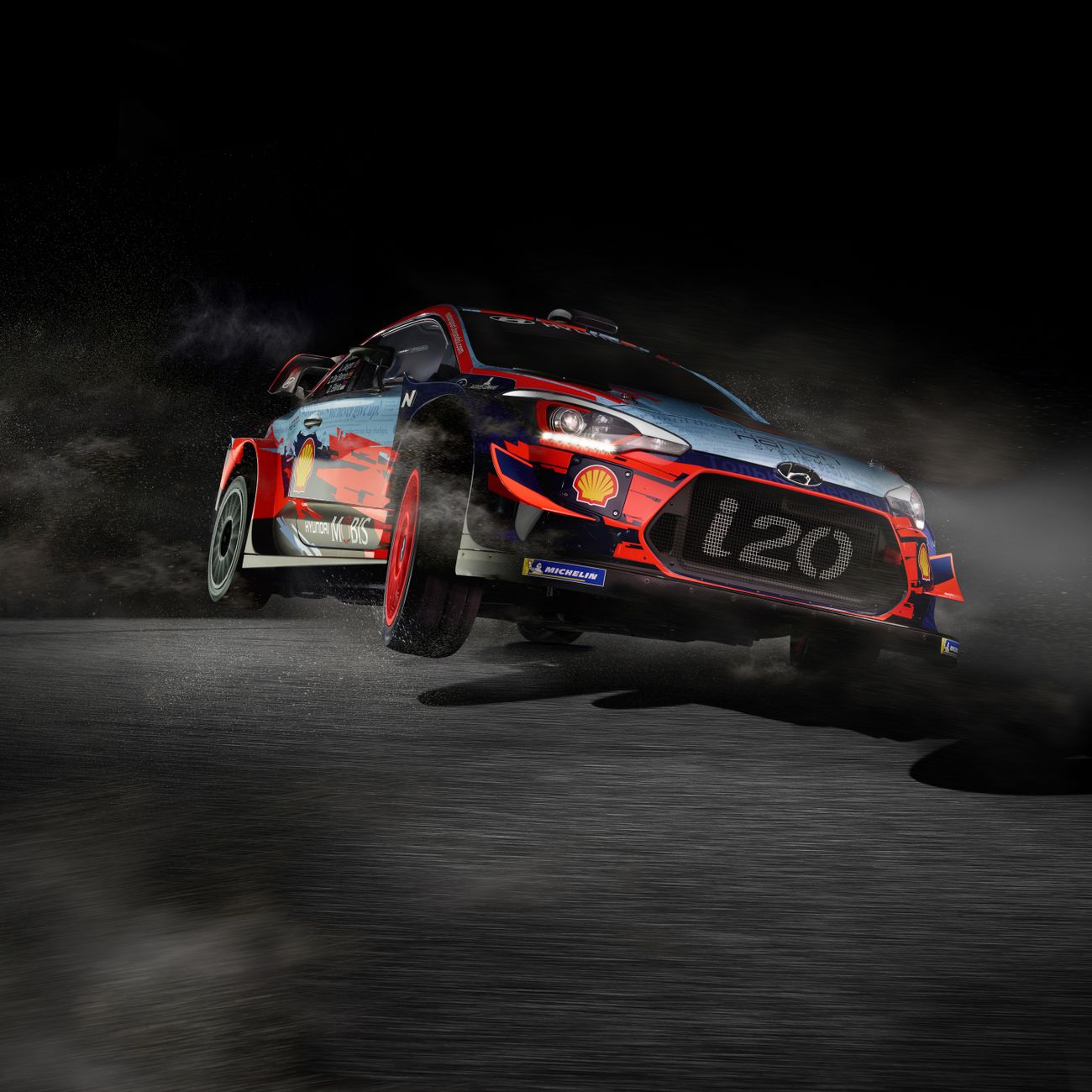 High-speed rally car skidding on dirt track at night, showcasing thrilling motorsport action.