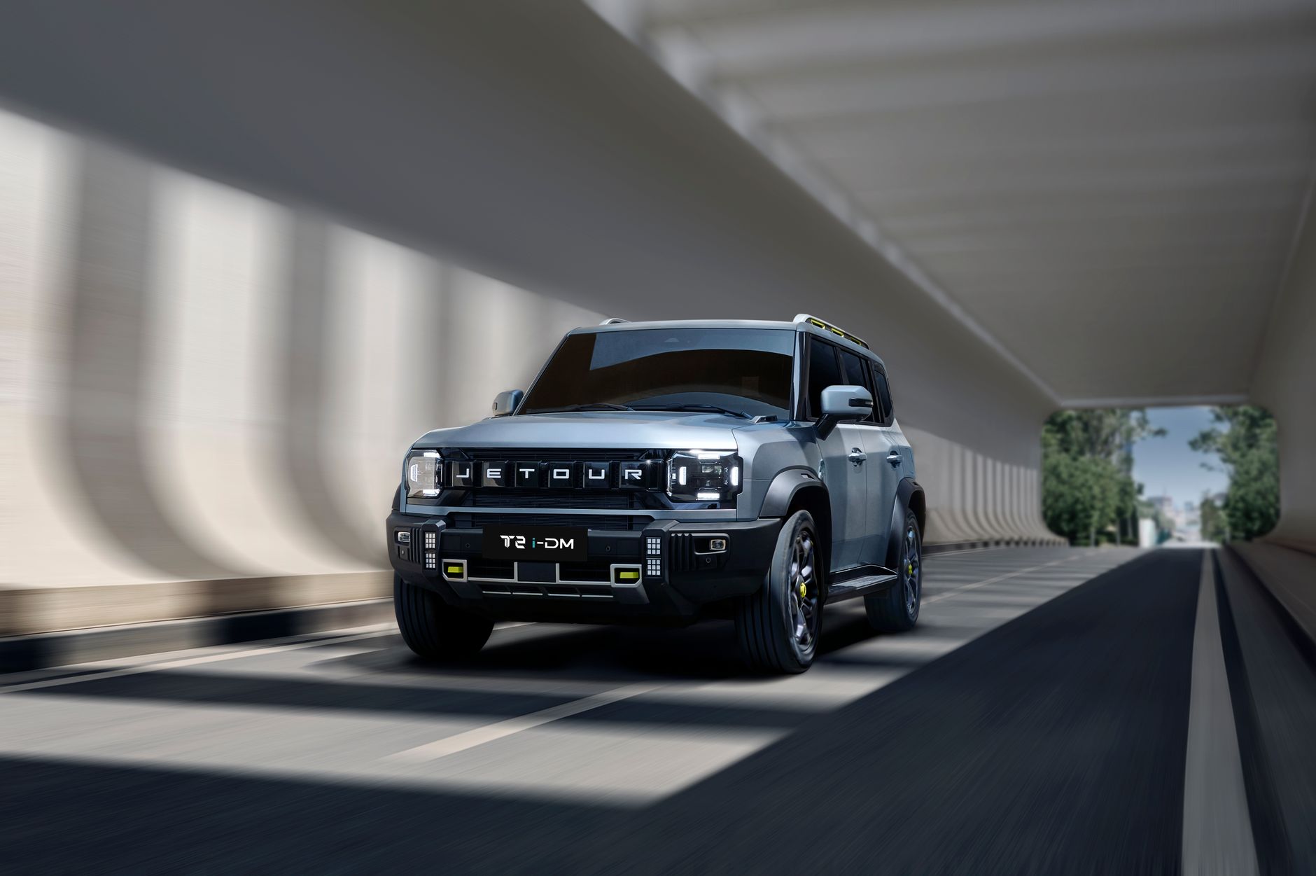 Jetour T2 SUV cruising through a contemporary tunnel, showcasing sleek modern design.