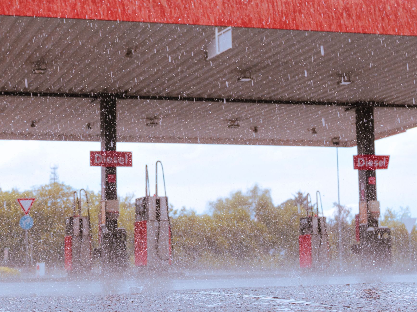 A gas station in Dallgow-Döberitz, Germany, during a rainy day.